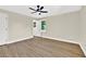 Bright bedroom featuring hardwood floors and a view of trees at 486 Edward Ct, Marietta, GA 30066