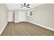 Spacious bedroom with natural light, ceiling fan and laminate flooring at 486 Edward Ct, Marietta, GA 30066