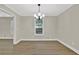 Dining room featuring a modern chandelier, large windows, and access to other rooms at 486 Edward Ct, Marietta, GA 30066