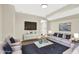 Inviting basement living room area featuring comfortable seating, a TV, and a stylish coffee table at 486 Edward Ct, Marietta, GA 30066