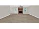 Bright, open living room with light gray walls, wood-look floors, and brick fireplace at 486 Edward Ct, Marietta, GA 30066