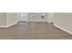 Spacious living room features new light-colored laminate flooring and freshly painted walls at 486 Edward Ct, Marietta, GA 30066