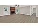 Bright living room with brick fireplace, ceiling fan and light-colored wood-look flooring at 486 Edward Ct, Marietta, GA 30066