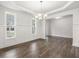 Elegant dining room featuring detailed trim, natural light, and hardwood flooring at 76 Parkview Dr, Dallas, GA 30157