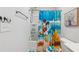 Bright bathroom features a shower/tub combo with playful Disney-themed decor, adding a fun touch at 8609 Lakeview, Jonesboro, GA 30238