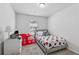 bedroom featuring neutral walls, carpet, a single window, a twin bed and red firetruck play tent at 8609 Lakeview, Jonesboro, GA 30238