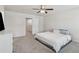 Cozy bedroom with neutral decor, featuring a ceiling fan, providing a serene and welcoming space at 8609 Lakeview, Jonesboro, GA 30238