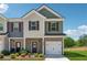 Charming two-story townhome featuring a brick facade, attached garage, and well-maintained landscaping at 8609 Lakeview, Jonesboro, GA 30238