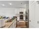 Modern kitchen with stainless steel appliances, granite countertops, and white cabinetry, perfect for cooking at 8609 Lakeview, Jonesboro, GA 30238
