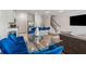 Contemporary living space with an eat-in kitchen, blue seating and stainless steel appliances at 8609 Lakeview, Jonesboro, GA 30238