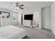 Comfortable bedroom featuring a ceiling fan, large windows, and ample storage in a well-lit space at 8609 Lakeview, Jonesboro, GA 30238