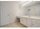 Bathroom featuring a long vanity, mirror and carpeted floors at 120 Stanmore Ct, Roswell, GA 30075