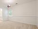 Bright bedroom with neutral carpet, a hanging airplane model, and a window with natural light at 120 Stanmore Ct, Roswell, GA 30075