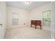 Bright bedroom featuring neutral walls, carpet, with natural light through the windows at 120 Stanmore Ct, Roswell, GA 30075