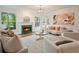Inviting living room featuring a fireplace, hardwood floors, and ample natural light at 120 Stanmore Ct, Roswell, GA 30075