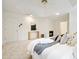Bright main bedroom featuring neutral walls, carpet, and a fireplace at 120 Stanmore Ct, Roswell, GA 30075