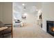 Bright main bedroom featuring neutral walls, carpet, and a fireplace at 120 Stanmore Ct, Roswell, GA 30075