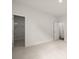 Bright bedroom with an attached closet featuring shelving and carpeting at 122 Parkview Dr, Dallas, GA 30157