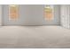 Bright bedroom with windows and plush neutral carpeting at 122 Parkview Dr, Dallas, GA 30157