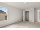 Well-lit bedroom featuring a closet and soft carpeting at 122 Parkview Dr, Dallas, GA 30157