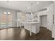 Gourmet kitchen with white cabinetry, quartz countertops, and a central island with pendant lighting at 122 Parkview Dr, Dallas, GA 30157