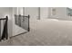 Expansive living area with neutral walls, soft carpeting, and views out the windows at 122 Parkview Dr, Dallas, GA 30157