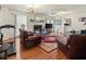 Inviting living room with hardwood floors, a fireplace, and plenty of seating at 1480 Niskey Lake Sw Rd, Atlanta, GA 30331