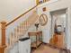 Carpeted stairway with wooden railing and decorative accents at 1480 Niskey Lake Sw Rd, Atlanta, GA 30331