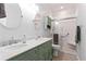 Modern bathroom features double sinks, stylish vanity, and walk-in shower at 235 Huiet Dr, Mcdonough, GA 30252