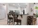Open kitchen with breakfast bar and modern appliances at 235 Huiet Dr, Mcdonough, GA 30252