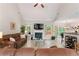 Open concept living room featuring vaulted ceiling, access to kitchen, and outside views at 235 Huiet Dr, Mcdonough, GA 30252