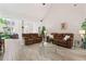 Spacious living room with vaulted ceilings, tile floors, and ample natural light at 235 Huiet Dr, Mcdonough, GA 30252
