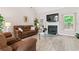 Cozy living room with a fireplace, TV, comfortable seating, and neutral color scheme at 235 Huiet Dr, Mcdonough, GA 30252