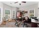 Inviting office space featuring multiple windows for ample natural light, comfortable seating, and practical workspace at 235 Huiet Dr, Mcdonough, GA 30252