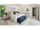 The primary bedroom boasts a large bed, a patterned area rug, and scenic outdoor views at 239 Devonwood Dr, Atlanta, GA 30328
