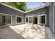 Private patio with neutral tones, large windows, and string lights, perfect for outdoor relaxation and entertaining at 239 Devonwood Dr, Atlanta, GA 30328