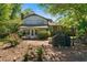 Backyard patio area with a grill and view of the home's rear exterior at 2921 Huntcliff Dr, Marietta, GA 30066