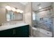 Bathroom showcasing a walk-in shower with tiled wall and green vanity at 2921 Huntcliff Dr, Marietta, GA 30066