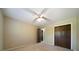 Bedroom featuring neutral walls, plush carpeting, wooden closet doors, and ceiling fan ensuring a relaxing space at 2921 Huntcliff Dr, Marietta, GA 30066