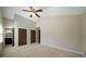Bedroom featuring carpeted floor, ceiling fan, and ensuite bathroom at 2921 Huntcliff Dr, Marietta, GA 30066