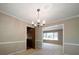 Traditional dining room featuring a chandelier and open access to adjacent living spaces at 2921 Huntcliff Dr, Marietta, GA 30066