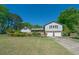 Charming home exterior with a manicured lawn and a two-car garage at 2921 Huntcliff Dr, Marietta, GA 30066
