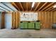 Neat garage featuring wooden beams, a work bench with tools, and a door for extra functionality at 2921 Huntcliff Dr, Marietta, GA 30066