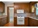 Classic kitchen with wooden cabinets and white appliances at 2921 Huntcliff Dr, Marietta, GA 30066