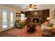 Cozy living room with a stone fireplace, built-in bookshelves, and plenty of natural light at 2921 Huntcliff Dr, Marietta, GA 30066