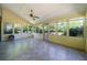 Relaxing sunroom featuring tiled floor, ceiling fan, and lots of windows with views at 2921 Huntcliff Dr, Marietta, GA 30066