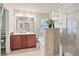 Bathroom featuring a soaking tub, glass enclosed shower, and double sink vanity at 3229 Hallmark Ln, Buford, GA 30519