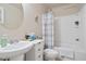 Neutral bathroom featuring a vanity, toilet, and tiled tub-shower combo at 3229 Hallmark Ln, Buford, GA 30519