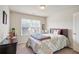 Cozy bedroom featuring carpet flooring, a comfortable bed, and a large window at 3229 Hallmark Ln, Buford, GA 30519