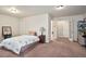 Cozy bedroom with neutral tones, carpet flooring, and a nearby closet space at 3229 Hallmark Ln, Buford, GA 30519